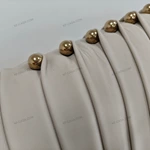 Light Beige Leather Upholstered Bed with Vertical Pleated Headboard & Gold Stainless Steel Ball Studs